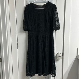 Large black, lace knee length dress.